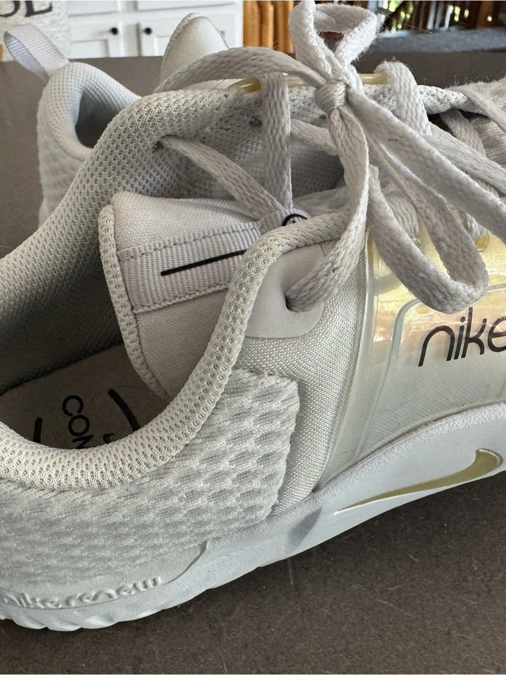 Nike White Sneakers with Gold Accents